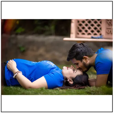 A sweet and intimate moment, with the couple in casual clothes, lying on the grass. This style is perfect for capturing your natural connection.