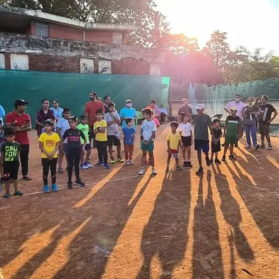 Our young players gathered on the court during a tournament weekend at our academy. This is where the journey begins, with Red and Orange ball matches for our youngest competitors.