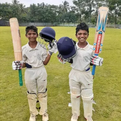 Future opening pair? Two of our young batsmen, fully kitted out and ready for action, showcasing the professional gear and confident attitude we instill in our players.