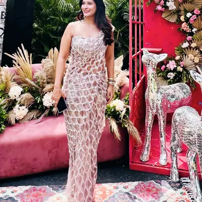 Our signature draped saree dress in sequinned tulle, seen here on a client at an outdoor event. This is the perfect outfit to make heads turn.