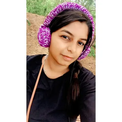 Give your headphones a unique and cozy makeover with my custom crochet headset covers. Here I am modeling a purple and white set.