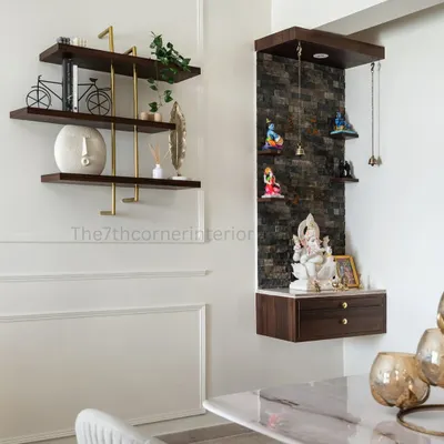 In alignment with Vaastu principles, I incorporated this dedicated pooja mandir into the dining area. The back panel features Spanish stone cladding, symbolizing stability and grounding.