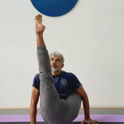 Chakorasana is an advanced arm balance that requires immense core strength, balance, and hip flexibility. It is named after a mythical bird and embodies a sense of lightness and elevation.