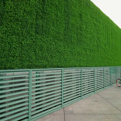 An example of a large-scale exterior project where my artificial green wall provides a bold, maintenance-free facade. This solution is ideal for commercial properties looking to enhance their curb appeal and create a memorable, eco-friendly statement.