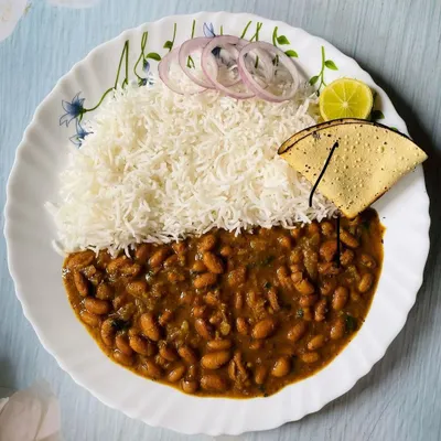 You can never go wrong with a plate of classic Rajma Chawal. I make it just like you would at home, served with long-grain rice, fresh salad, and a crispy papad. It's the perfect comfort food for a quick vegetarian lunch.