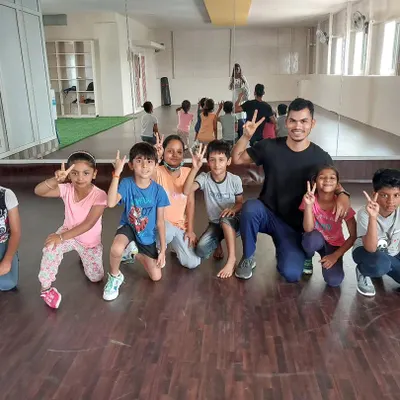 Fitness is for everyone, and I love bringing that energy to my kids' dance fitness classes. Here I am with my amazing group of young champs after a fun-filled session of movement and games.