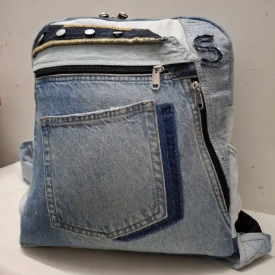 This is another example of a custom backpack made from upcycled denim. I use different shades of denim and original hardware to create a durable bag with plenty of pockets and personality.