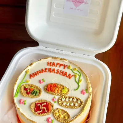 A special bento cake for an Annaprashan ceremony, which marks a baby's first taste of solid food. We hand-piped miniature edible versions of traditional foods, jalebis, and laddoos onto the cake.