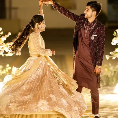 The first dance as husband and wife. I love capturing the movement and joy in moments like this, with the bride's lehenga twirling beautifully.