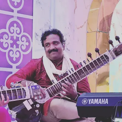 A photo from a live concert. Whether the event is large or small, I always aim to connect with the audience through the pure emotion of the raag.