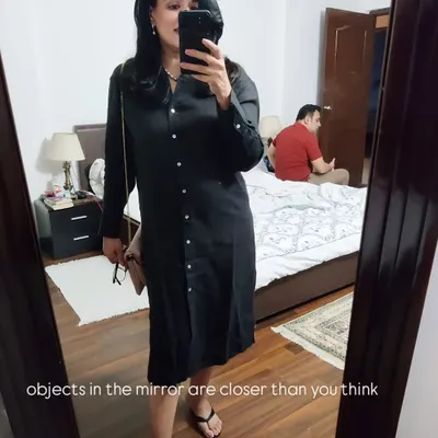 A comfortable black shirt dress is a versatile piece for a relaxed evening out. Here, I've paired it with pink baroque pearls for a touch of elegance.