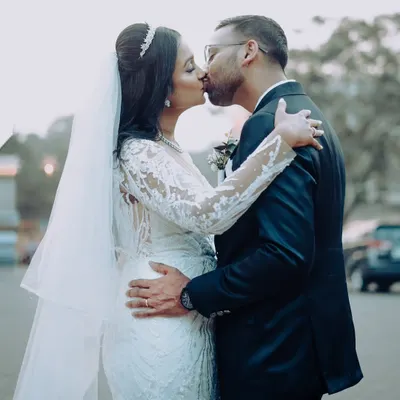 A romantic kiss shared by the newlyweds. This is the moment your new life begins, and I am there to capture it forever.