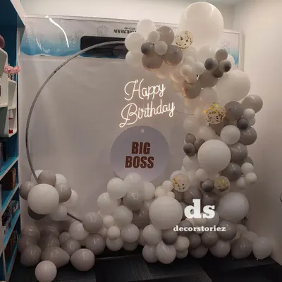 An alternate view of our popular 'Big Boss' birthday setup. This angle shows how the balloon garland and ring frame create a full, three-dimensional photo opportunity that can fit into an office corner.