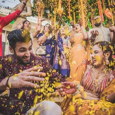 A burst of marigold petals and pure joy. Bhavita and Niel's Haldi was a vibrant, energetic celebration, and we were there to catch every happy moment.