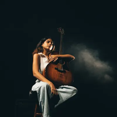 I started writing music at 10, and it has saved me in more ways than I can say. This is me with my guitar, my oldest friend and confidant.