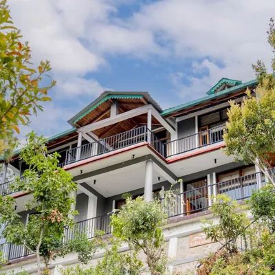 An exterior view of 'The Mountain Home', showcasing its multi-level architecture designed to integrate seamlessly with the surrounding landscape.