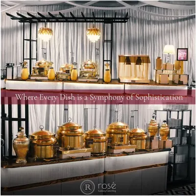 Our buffet setups are a symphony of sophistication, featuring gleaming copper and brass chafing dishes that keep food at the perfect temperature. This collage showcases the scale and elegance of our presentation for large corporate events.