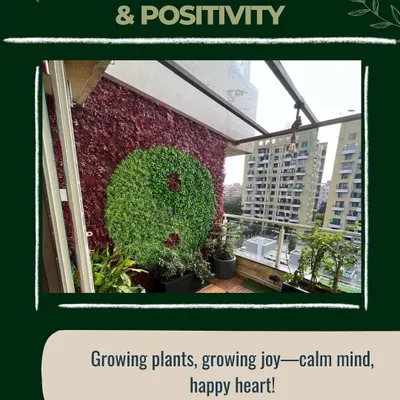 A vertical garden can be a true work of art. For this balcony, I designed a custom yin-yang pattern using contrasting red and green foliage, creating a unique focal point that boosts mood and positivity.