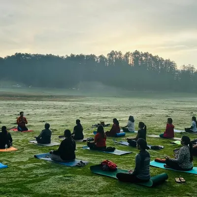 A serene morning meditation session with our group in the vast, dew-covered meadows of Khajjiyar. Practicing in such pristine natural surroundings helps deepen the meditative experience.