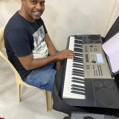 Here is one of our adult students enjoying his keyboard lesson. Our curriculum is designed to be flexible, whether you want to learn Indian classical tunes or popular Western music.