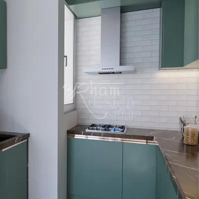 This is the final render of a kitchen I designed for a client who adores green. The matte green cabinets, dark marble countertop, and modern chimney create a sleek and efficient cooking space.