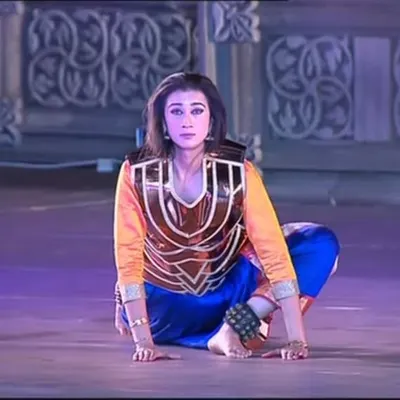 A moment from my dance drama "The Wheel of Choices" at the Khajuraho Dance Festival. Here, I am portraying a character with an intense, grounded pose that communicates strength and determination.