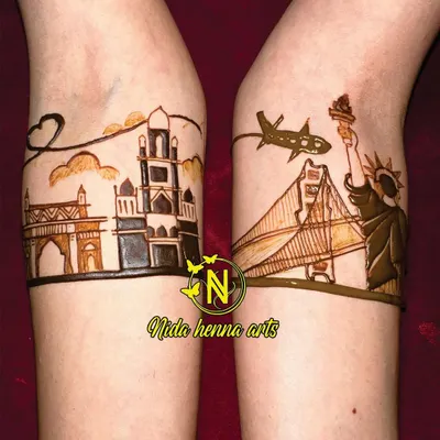 This design was for a long-distance couple. We featured the Mumbai skyline on one arm and the New York City skyline on the other to represent their two worlds coming together.