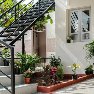 For this Anganwadi, we designed a multifunctional L-shaped staircase using concrete for the lower steps and steel for the upper treads. The space underneath is cleverly used as a small garden and will eventually become a sunken sandpit, providing a shaded and engaging outdoor play area for the children.