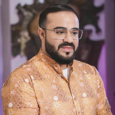 A close-up of the groom's Haldi look. The makeup is minimal and fresh, designed to give a natural glow that looks great for this vibrant daytime ceremony.