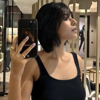 A year later and we're back with a fresh chop. This textured, choppy bob with soft bangs is effortlessly cool and easy to style.
