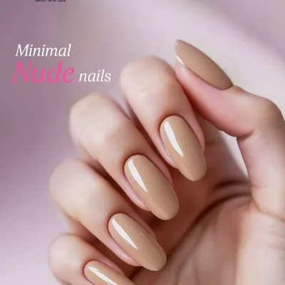 The epitome of elegance: a minimal nude manicure. This look features perfectly shaped, medium-length almond nails with a glossy, neutral polish for a sophisticated and clean finish.