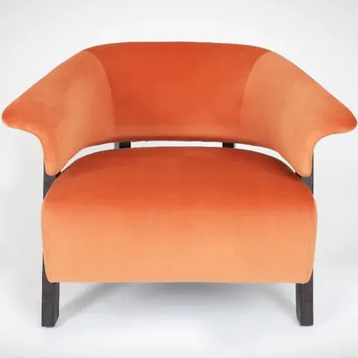 A direct, front-on view of the orange velvet armchair. This angle is essential for e-commerce listings as it clearly shows the product's shape, symmetry, and overall design.