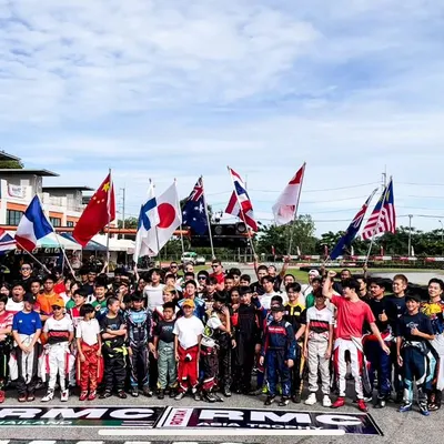 Representing India on the international stage. Our drivers stand with competitors from around the world at the RMC Asia Trophy, a proud moment for the entire team.