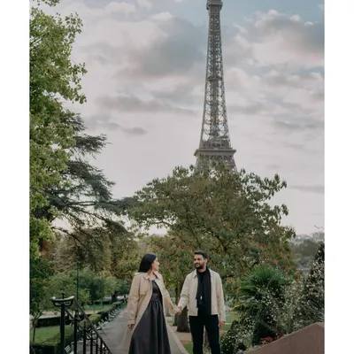 A quiet moment together on the steps of Paris, with the Eiffel Tower standing tall. This destination pre-wedding portrait captures the classic romance of the city.