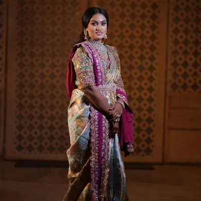 A regal portrait session for a client, featuring a stunning hand-embroidered blouse and a beautiful Kanjeevaram saree. The makeup was designed to give a royal, timeless feel.