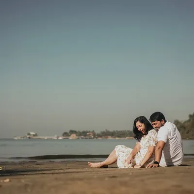 Sanket and Apeksha sharing a quiet moment on the sands of Goa. Our destination pre-wedding shoots are designed to be a fun experience, letting us capture your story against a stunning landscape.