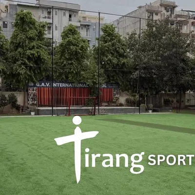 A clear view of our lush green turf for box cricket and football at the Tirang Sports Arena in Gurugram. The high netting ensures the ball always stays in play.