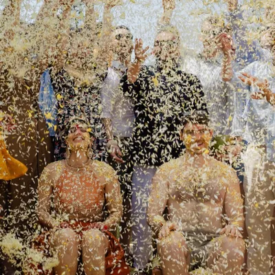A moment of absolute joy as Dhwani and David are showered with flower petals during their Goa Haldi. This is the kind of happy, chaotic energy we love to capture.