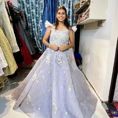 This lavender gown is perfect for a fairytale moment. The embellished bodice and flowing skirt create a beautiful silhouette, and I can alter it to fit you perfectly for your special occasion.