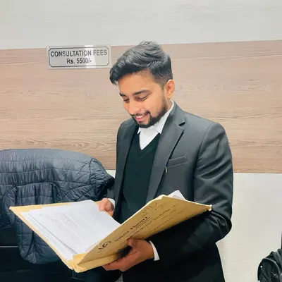 A lawyer's legacy is defined by the lives they touch and the principles they uphold. Here I am in my office, reviewing a case file with the consultation fee structure visible for transparency.