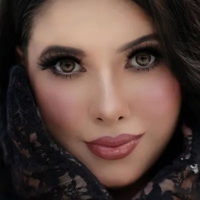 This extreme close-up focuses on a flawless makeup look, highlighting the soft glam eyeshadow, defined brows, and glossy lips. The lace gloves add a touch of vintage elegance, perfect for a beauty campaign.