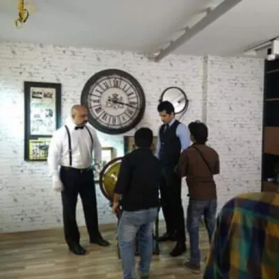 A behind-the-scenes look at an ad shoot for an international perfume brand in Delhi. My role was complete costume styling, developing a specific character look with a classic white shirt, bow tie, and suspenders to fit the campaign's narrative.