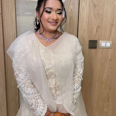 A celestial-themed sangeet or reception look. I created a textured, curly ponytail to go with her ethereal white outfit.