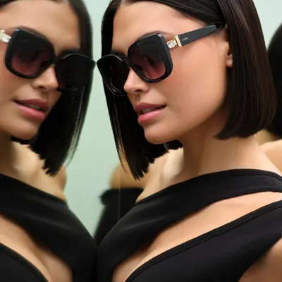 A clean, sophisticated shot for an IDEE Eyewear campaign. Using a mirror creates a dual perspective, showcasing the sunglasses from multiple angles while adding depth and a touch of intrigue.