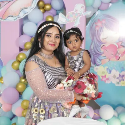 Our lovely client Annu celebrating her daughter's birthday. She chose a simple and elegant silver-finish choker that looks beautiful with her modern dress.