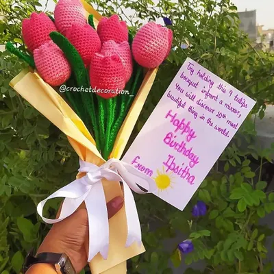 A stunning birthday bouquet of nine pink crochet tulips, complete with a personalized message card. This is a perfect example of how we help you create a heartfelt and memorable gift.