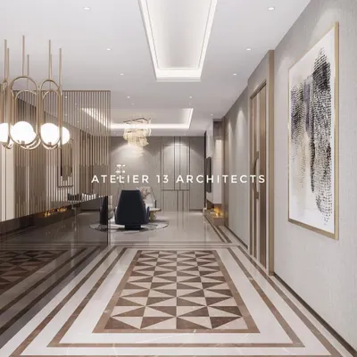 The entrance hallway of the Suncity residence features a stunning geometric marble inlay that acts as a floor rug. The long passageway is lined with elegant wall panels and lit by modern chandeliers, guiding visitors into the home.