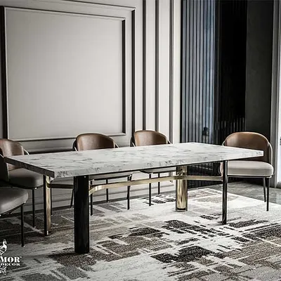 Our Delight dining table, where elegance meets functionality. The sleek marble top is supported by a dynamic metal and wood base, creating a sophisticated haven for any dining space.