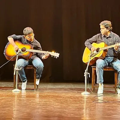 A closer look at our guitarists during their 'Sarvaang' performance. We teach students not just how to play, but how to perform as an ensemble, listening to each other and creating a cohesive sound on stage.