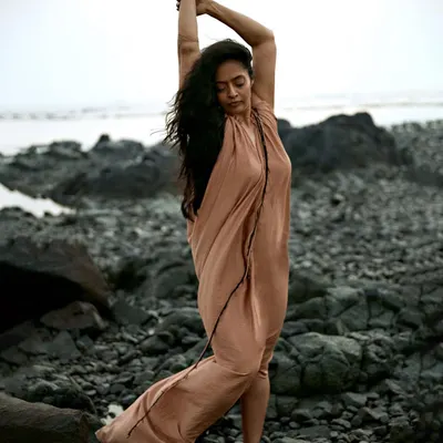 There is such freedom in an outdoor photoshoot. Here, we used the natural, rugged landscape of the beach to create a sense of movement and uninhibited expression for this powerful portrait.